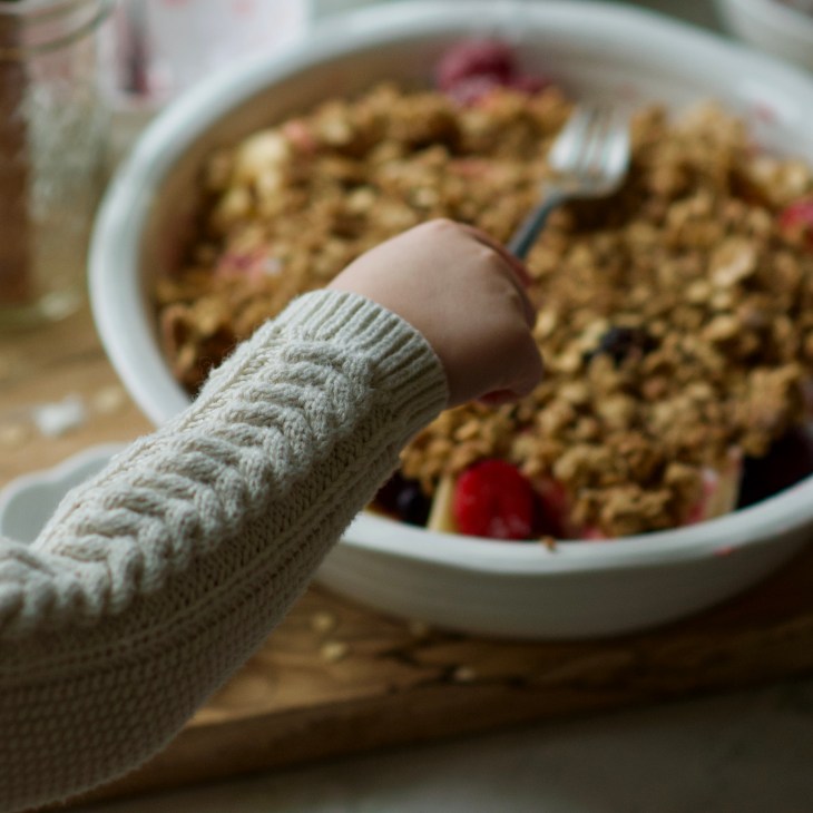 preparing an apple berry crumble