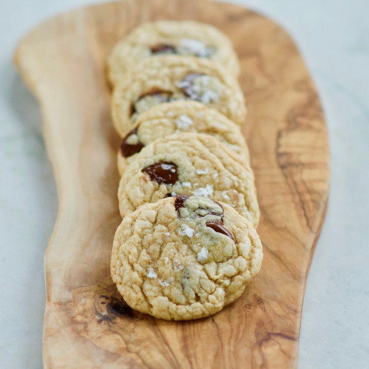 salted chocolate chip cookies on a wooden board