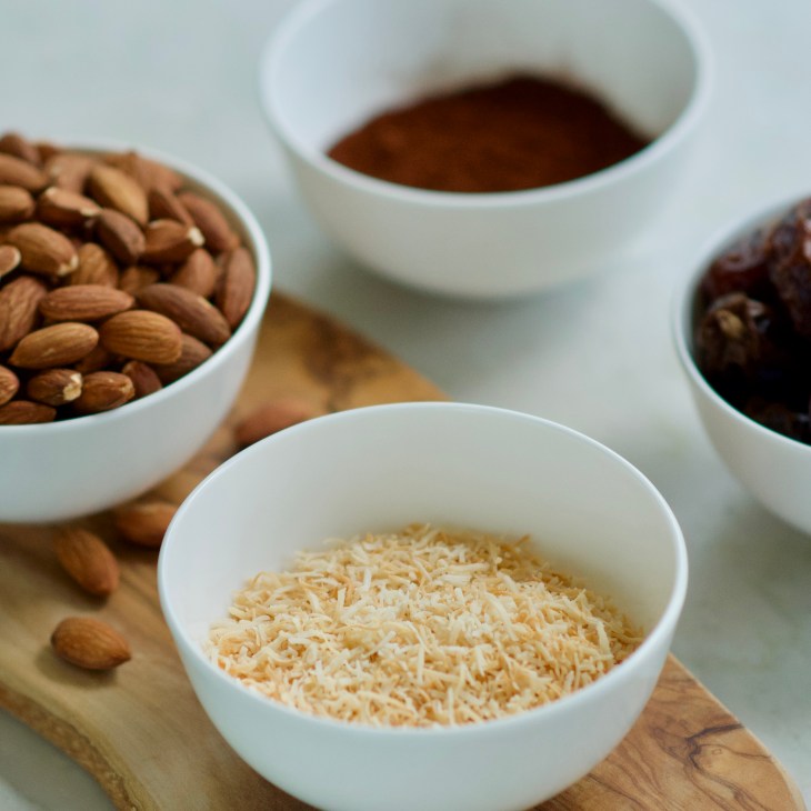 Ingredients for date almond bars, dates, almonds, coconut and cocoa powder