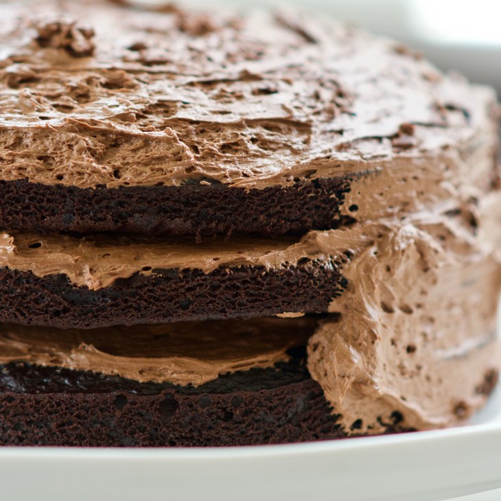 partially frosted chocolate cake