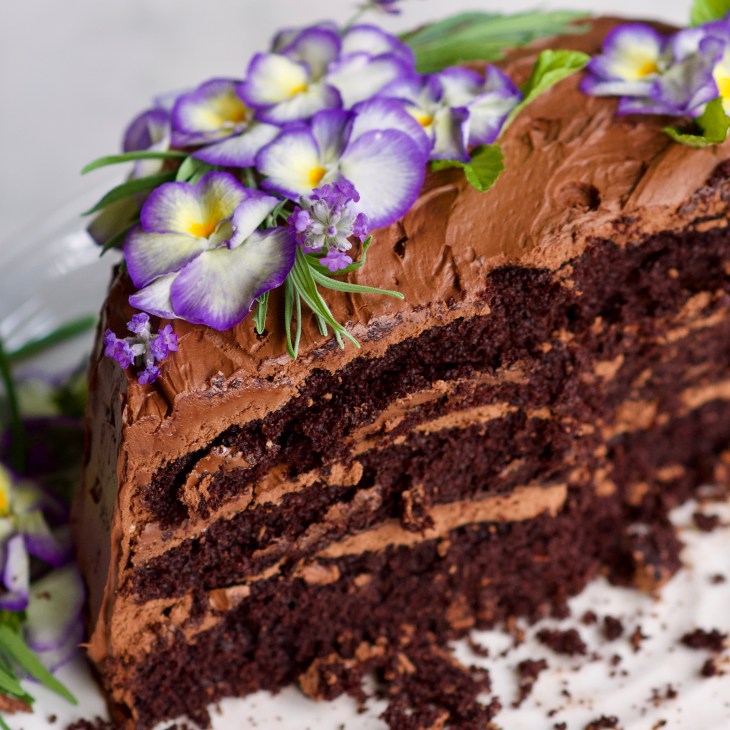 rebar chocolate cake with edible flowers cut in half